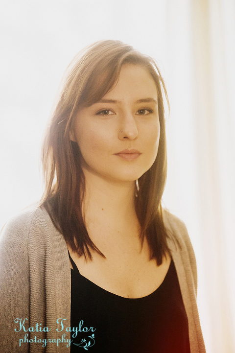 Headshot of model in warm backlight