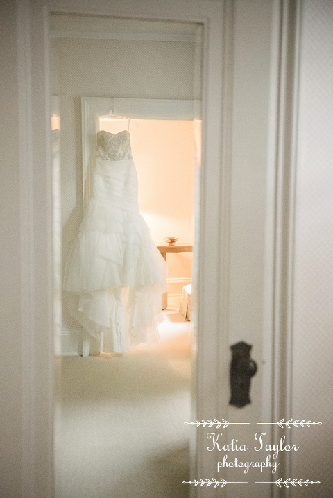 Gorgeous wedding dress hanging on a door frame, toronto