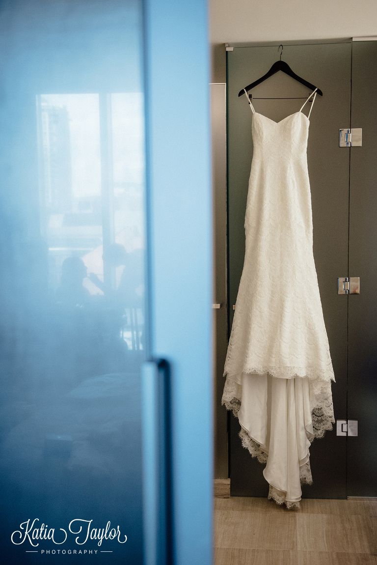 Bridal gown hanging in Four Seasons Hotel room, Toronto.