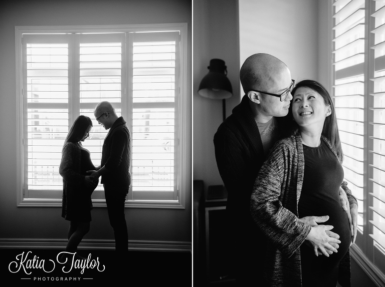 Expectant parents-to-be in front of window. Toronto maternity portraits.