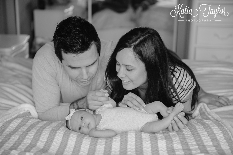 New parents admire their beautiful baby girl. Is any available to 2nd shoot with me this Sunday approx 2:30-8:30? Toronto newborn photographer. www.katiataylorphotography.com 