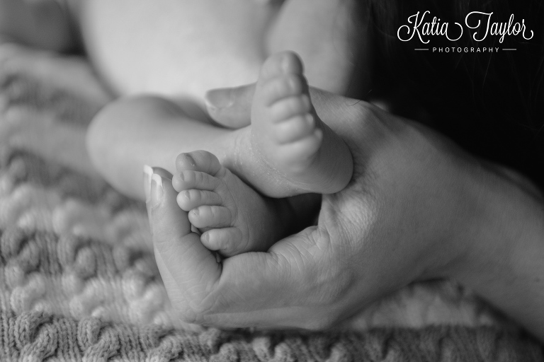 Cute little baby feet in mothers hands. Toronto newborn photographer. www.katiataylorphotography.com 