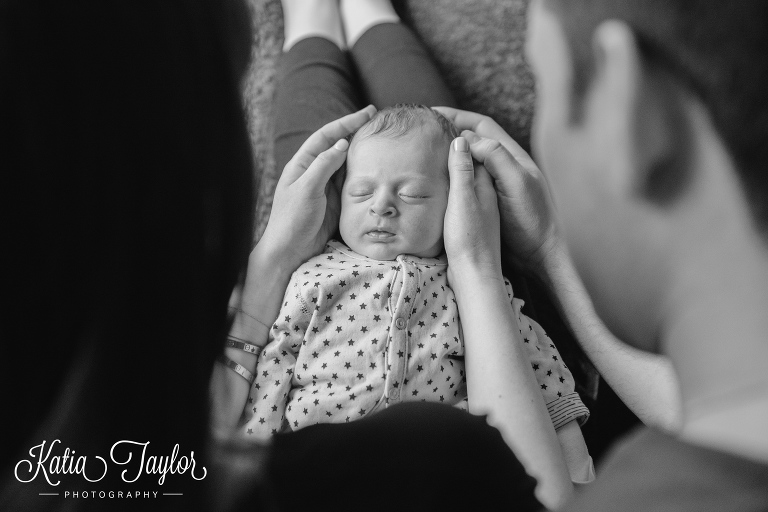 Sleeping newborn on mother's lap. Toronto lifestyle newborn portraits. www.katiataylorphotography.com