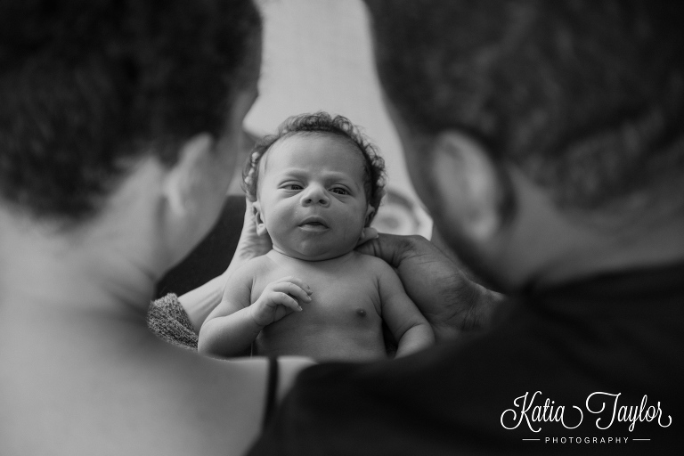 New parents admire newborn baby boy. Toronto newborn portraits.