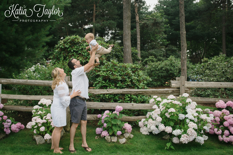 Dad swings his some in the air in Brueckner Rhododendron Park. Toronto Family Photography