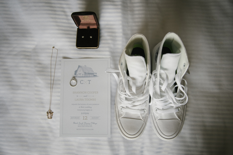 Bride's shoes and accessories including white Converse All-Stars. Toronto same-sex wedding. Black Creek Pioneer Wedding.