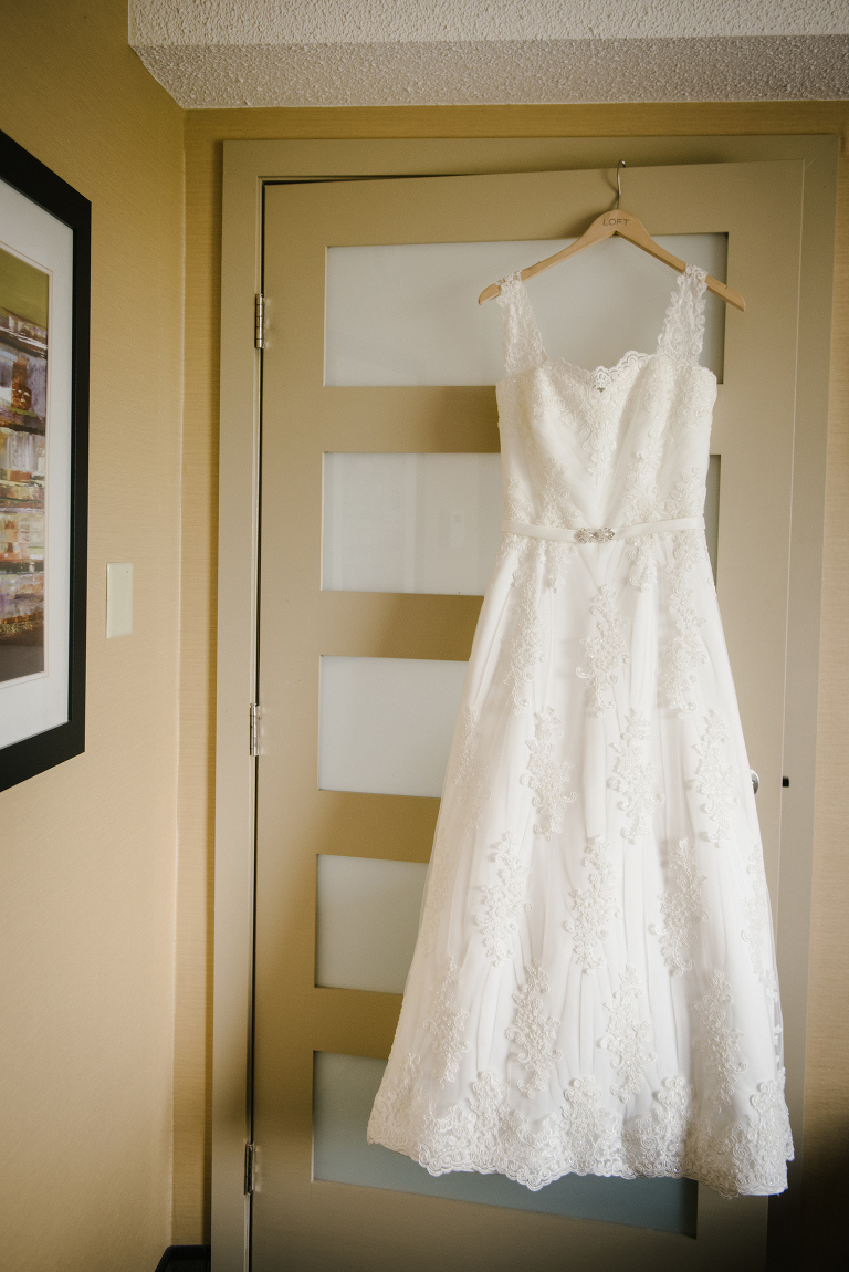 Wedding dress hanging. Toronto same-sex wedding. Black Creek Pioneer Wedding.