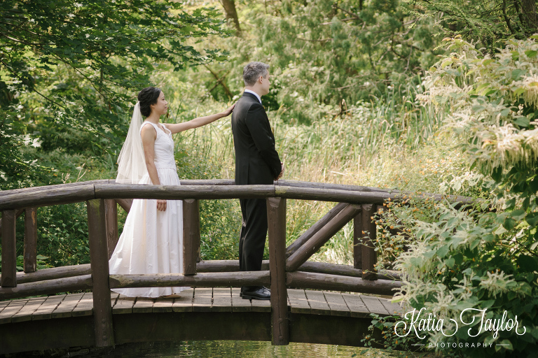 Bride and groom's first look on a bridge. James Gardens, Toronto wedding photography.