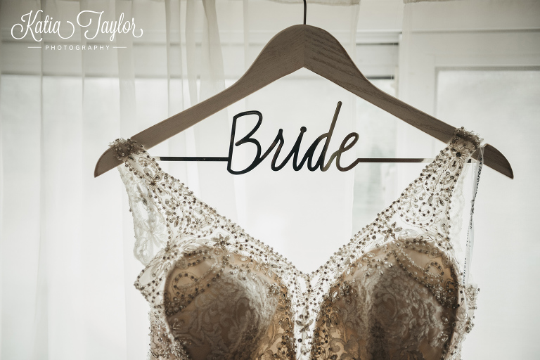 Wedding dress hanging on a "Bride" coat hanger. Toronto Ontario wedding photography.