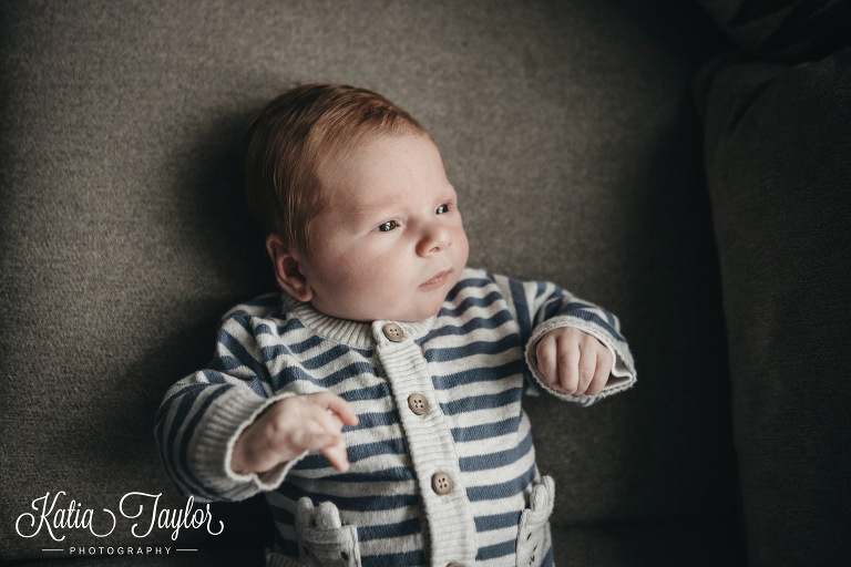 Newborn baby boy in striped sweater. Toronto newborn portrait.