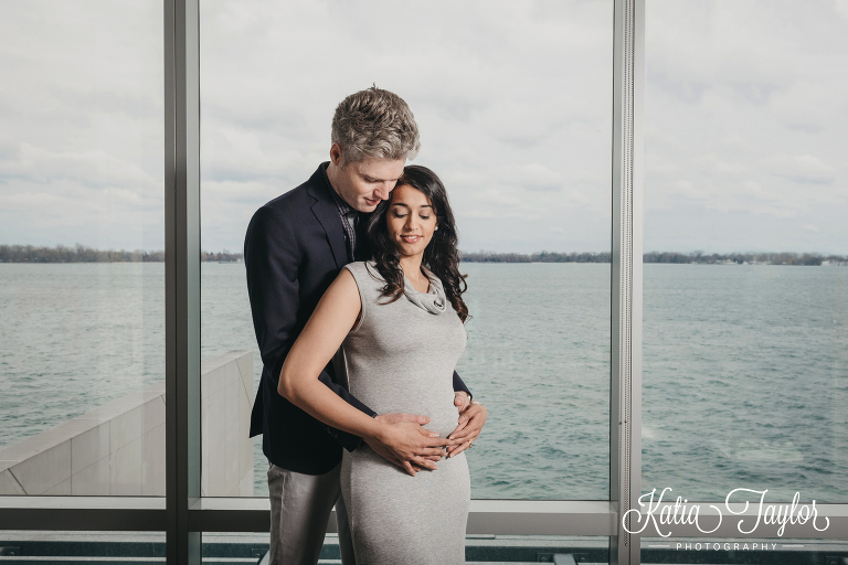 Excited parents-to-be at home in their condo. Maternity portraits in Toronto condo.