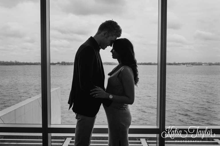 Silhouette of expectant parents in lake-front condo. Maternity portraits in Toronto condo.