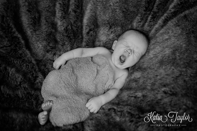 Newborn baby boy yawning. Toronto newborn baby photographer.