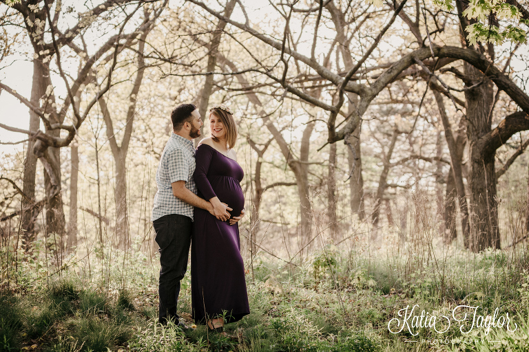 Maternity portrait in the forest. Purple gown and flower crown. Toronto High Park Maternity Portraits.